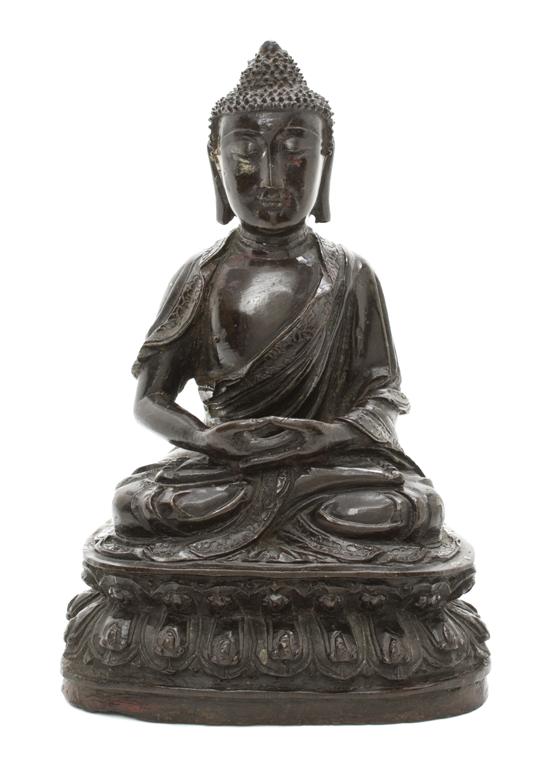 A Chinese Bronze Seated Buddha depicted