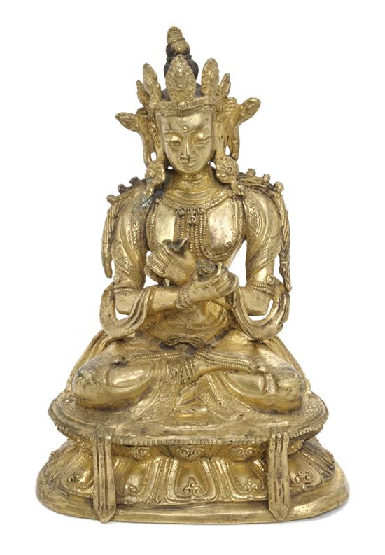 A Tibetan Gilt Bronze Figure of