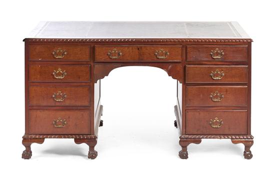 A Chippendale Style Pedestal Desk having