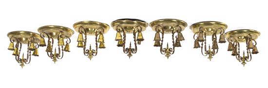 A Set of Seven Brass Ceiling Mount Four-Light