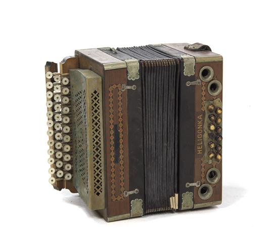 A Cased Accordion Heligonka of