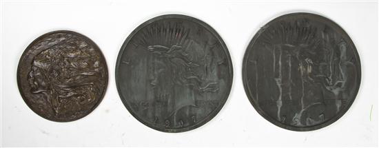 A Pair of American Cast Metal Medallions