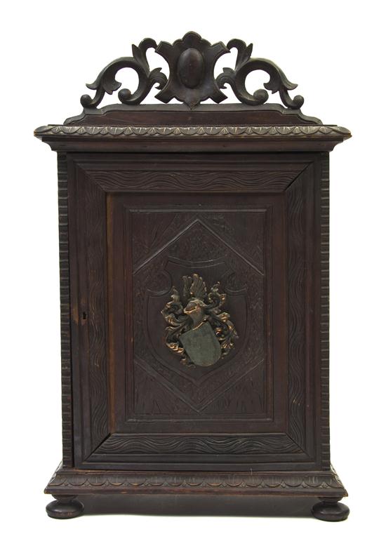 A Carved Mahogany Table Cabinet