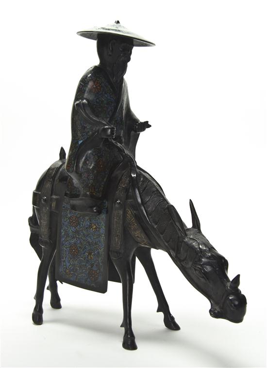 A Bronze Model of a Figure on a Donkey