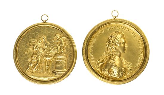 A Pair of Gilt Metal Roundels one