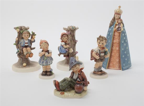 A Collection of Eight Hummel Figurines