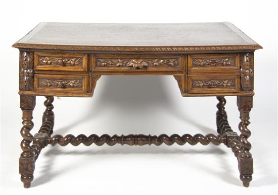 A Carved Wood Partners Desk the rectangular