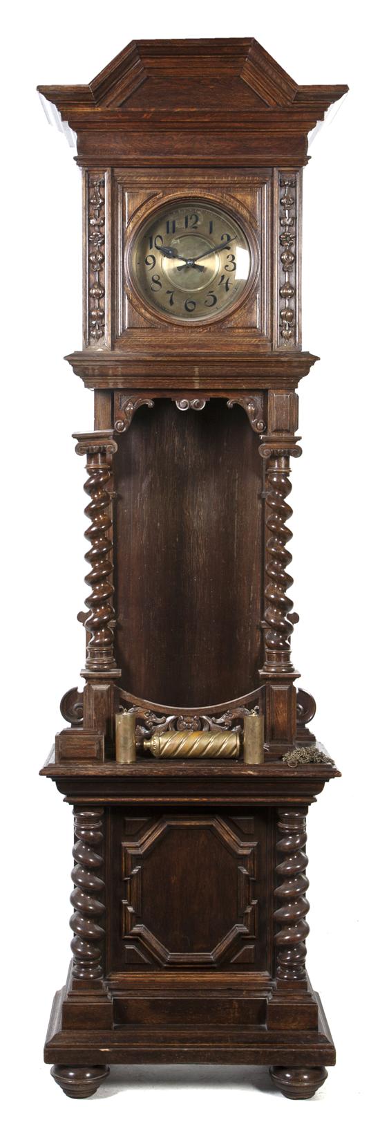 A Jacobean Style Carved Oak Tall