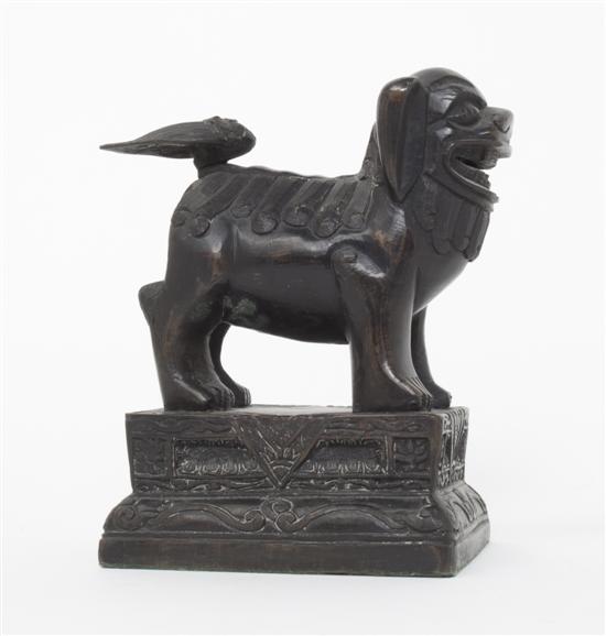 A Chinese Bronze Fu Dog the forward