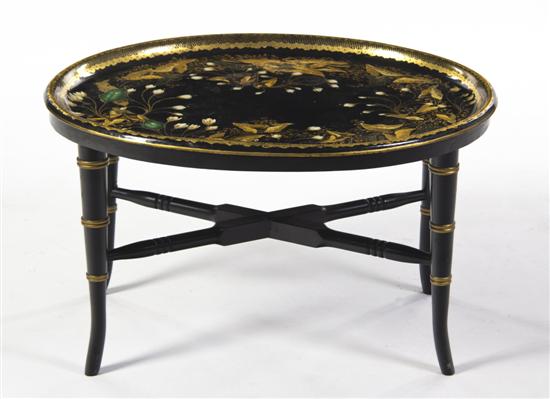 A Tole Tray on Stand of oval form with