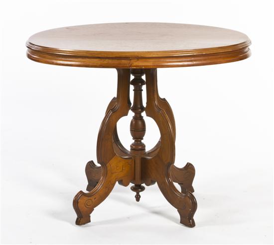 A Victorian Walnut Occasional Table