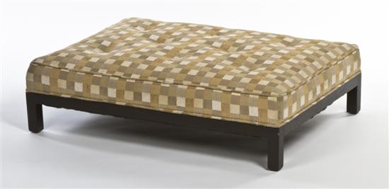 A Modern Upholstered Ottoman the