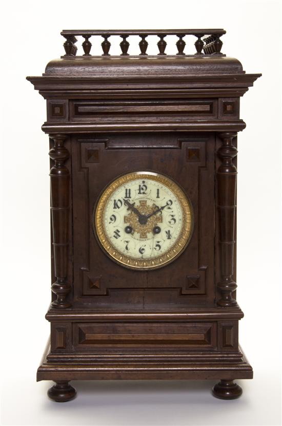 A Continental Walnut Mantel Clock