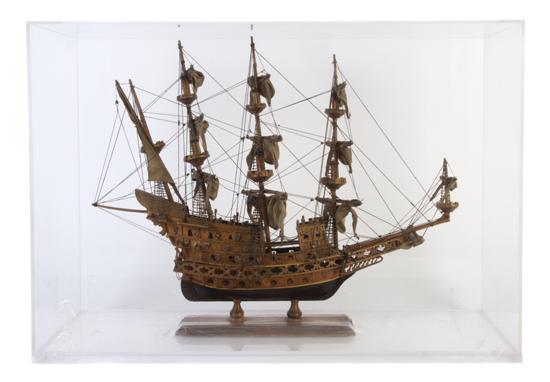 *A Model of a Three Masted Ship cased.