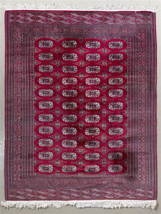 *A Bokhara Wool Rug having repeating