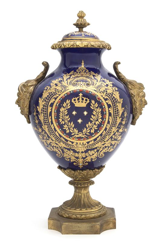 A Sevres Style Porcelain and Gilt Metal