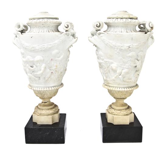A Pair of Parianware Urns of tapering