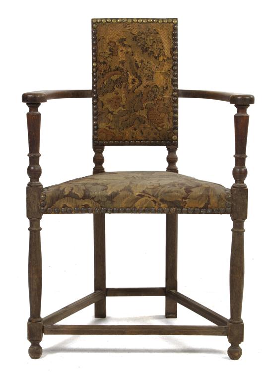 A Jacobean Revival Open Armchair having