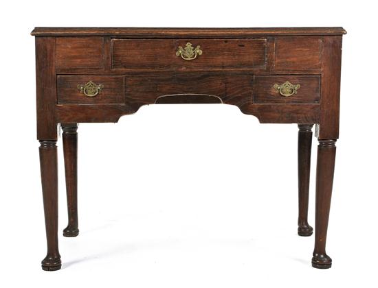 An English Oak Writing Table having 151852