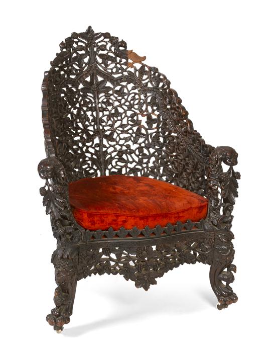 An Anglo-Indian Carved Armchair