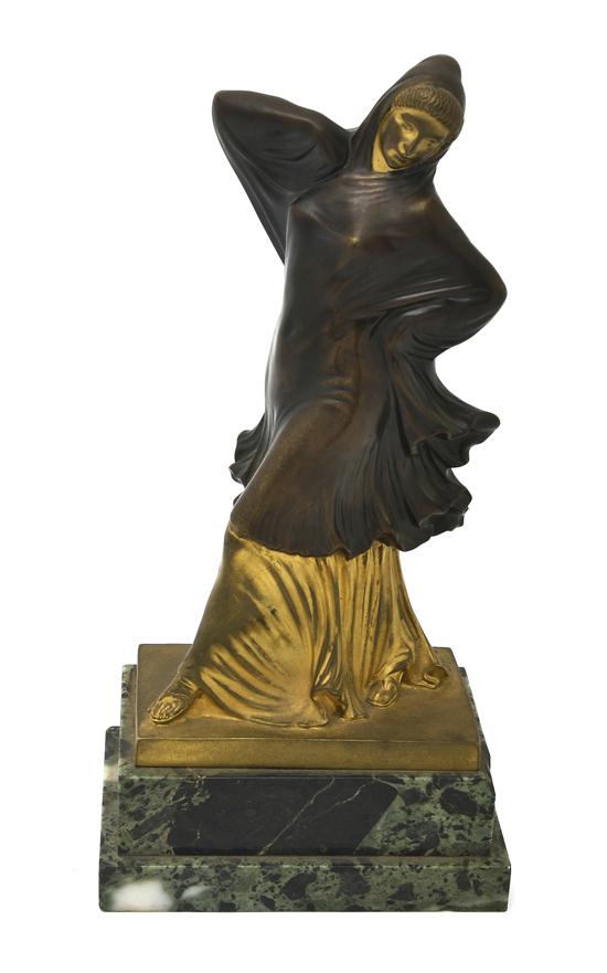 A Bronze Figure of a Woman after