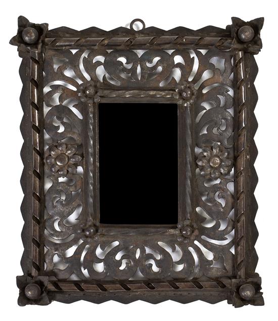 A Wrought Iron Mirror having a