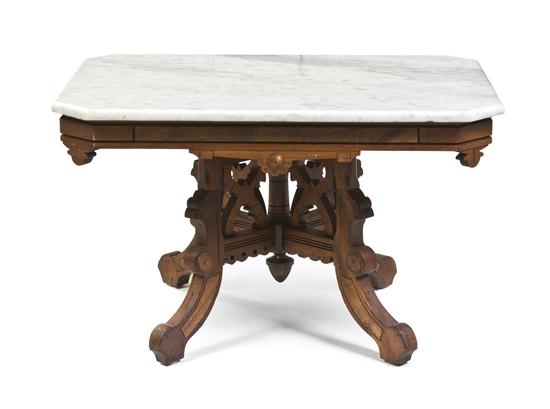 A Victorian Walnut Low Table having 154881