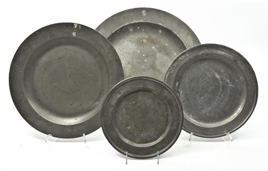 A Collection of Eight Pewter Chargers