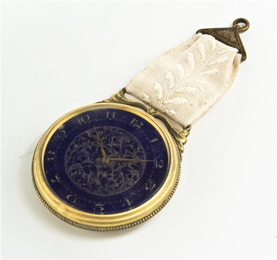 *A Swiss Gilt Metal and Enameled Clock