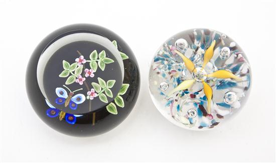 Two Glass Paperweights one having flower