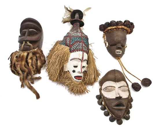  Four African Carved Wood Masks 1549a7