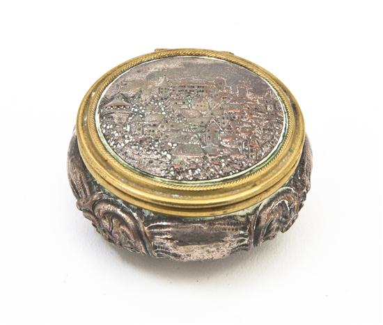 A Silver and Copper Box of circular