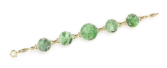 A 14 Karat Yellow Gold and Jade Bracelet