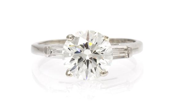 A Platinum and Diamond Ring containing