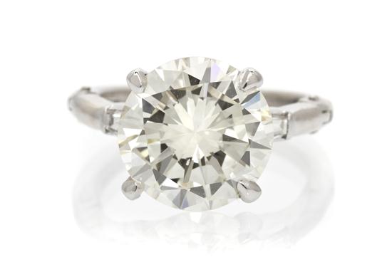 A Platinum and Diamond Ring containing