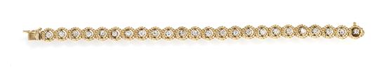 A 14 Karat Yellow Gold and Diamond