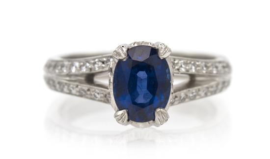 A Sapphire and Diamond Ring containing