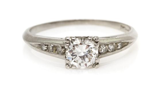 A Platinum and Diamond Ring containing