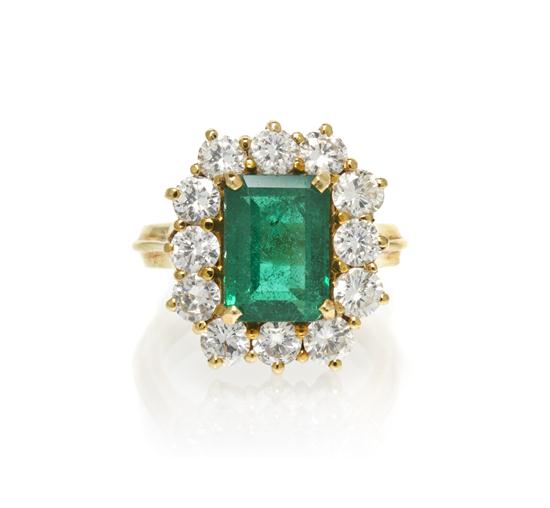 * An 18 Karat Yellow Gold Emerald