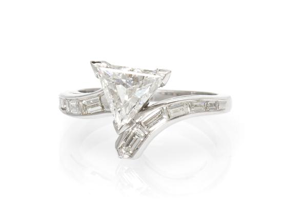 * A Platinum and Diamond Ring containing