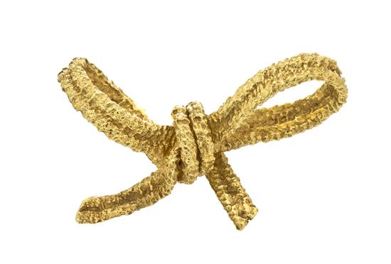 An 18 Karat Yellow Gold Bow Brooch
