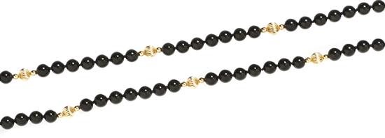 A Single Strand Onyx and Gold Bead