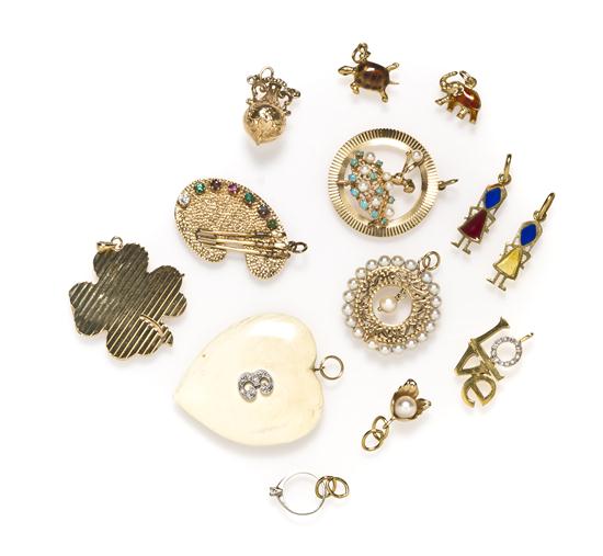 A Collection of Yellow Gold Charms consisting