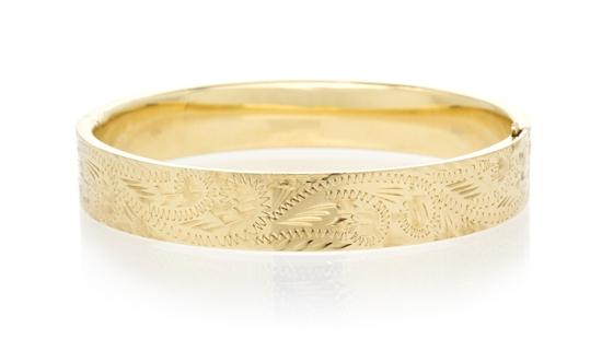 A 14 Karat Yellow Gold Hinged Bangle