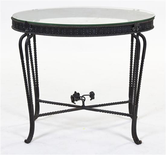 An Iron and Glass Occasional Table