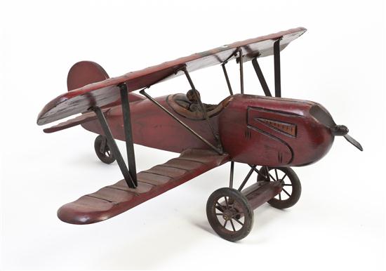 A Carved Wood Model of a Biplane with