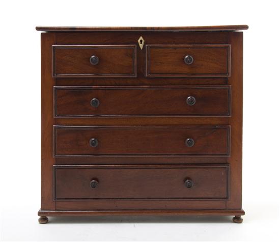 A Diminutive Mahogany Chest of