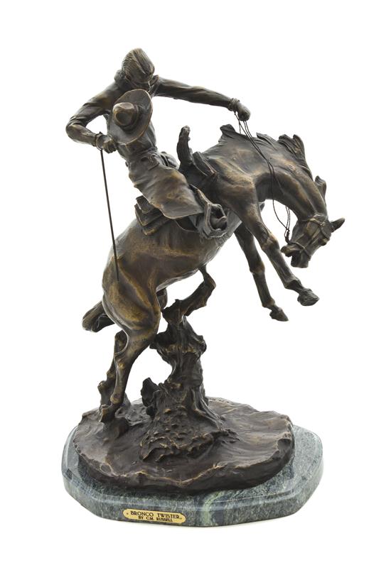 A Bronze Sculpture of a Cowboy after