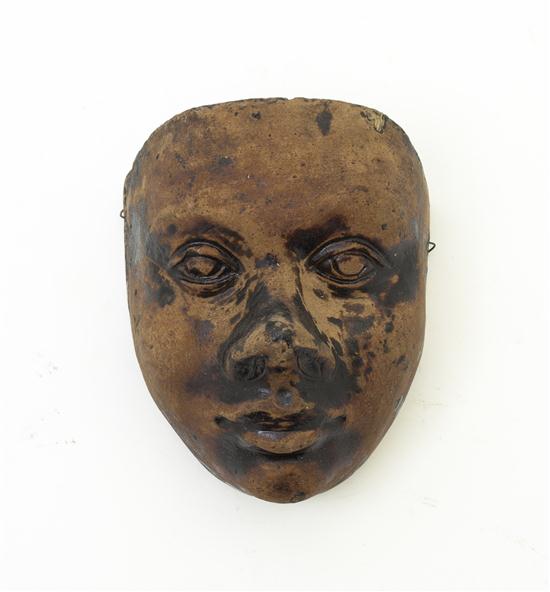  A Stoneware Mask having remnants 155456