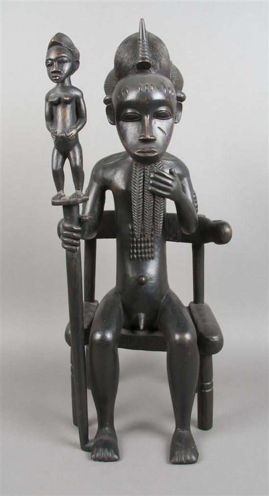 A Carved Wood Seated Figure Baule